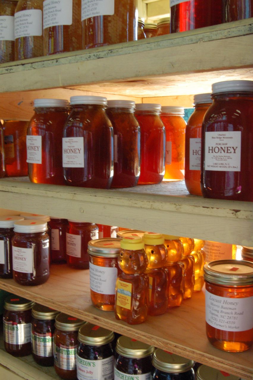 Honey jars on display at a farmers market